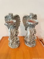 Front view of both resin angel statues