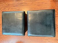 Top view of both black faux leather cube ottomans