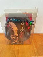 Front view of sealed retail package showing Sentry StudioStyle headphones