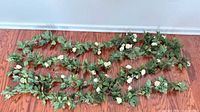 All four garlands spread out showing foliage and roses