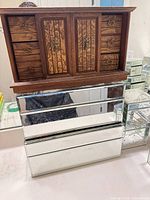 Complete jewelry chest showing wood upper section atop mirrored lower section