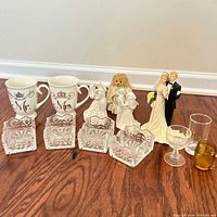 All items grouped: mugs, figurines, crystal dishes, small glasses