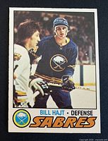 Front of Bill Hajt 1977-78 O-Pee-Chee hockey card showing player image and Sabres logo