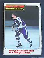 Front of 1978-79 OPC Darryl Sittler Highlights card showing action photo and caption
