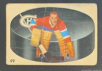Front of Jacques Plante Parkhurst card illustrating player pose and card number 49