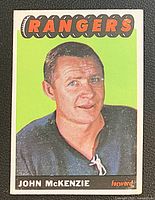 Front of 1965-66 Topps card #94 showing John McKenzie portrait and team header