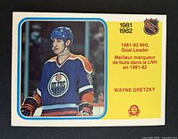Front of Wayne Gretzky O-Pee-Chee card showing player image and Goal Leader designation