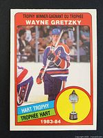Front of Wayne Gretzky O-Pee-Chee card showing image, title, trophy graphic and card number