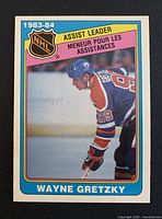 Front of Wayne Gretzky O-Pee-Chee card showing image, card number, assist leader banner