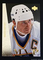 Front of Wayne Gretzky MVP card showing image, gold foil accents, Upper Deck logo, condition