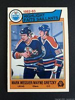 Front of 1983-84 OPC card #23 showing Messier and Gretzky on ice