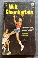 Front cover showing title, author, action photo, code T-169, price 50¢