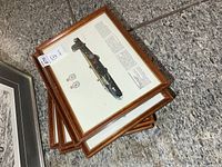 Stack of framed aircraft prints showing matching frames