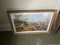 Full view of framed print leaning against wall