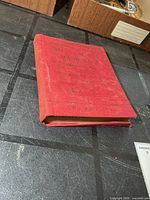 Front cover of red cloth-bound book