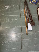 Group shot showing two chisels, bamboo ice pick, barrel cleaning rod
