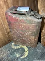 Front of steel jerry can showing G and OMC embossing