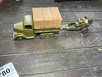 Side view of army truck towing launcher trailer
