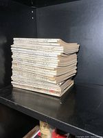 Full stack of Canadian Army Journal issues on shelf