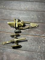 Overhead view of both artillery toys showing size and features