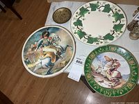 Four items: two Napoleonic scene plates, ivy pattern plate, small Our Navy metal dish