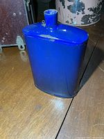 Front view of blue enamelware canteen