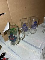 All three glasses together showing designs
