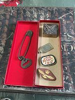 Group shot of all five militaria items in box