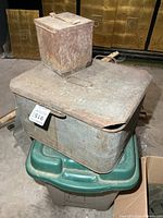 Large US-marked trunk and small carrier stacked, showing overall form and condition