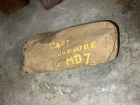 Canvas storage bag with yellow stenciled lettering