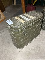 Front and side view of olive drab aluminum military cooler with handles and latches