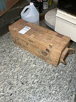 Full view of wooden ammunition crate on floor