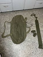 All items laid out: duffle bag, mess kit, three puttees