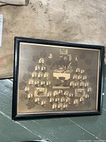 Full view of framed sepia military collage photograph