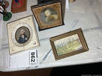 All three miniature framed prints displayed