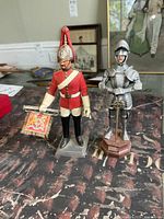 front view of both figures standing on table