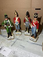 Group shot of all four porcelain officer figurines
