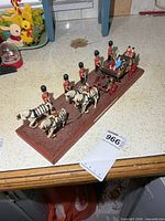 Overall view of diorama showing coach, guards, horses on base