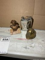 Overview of bust, helmet bell and flask