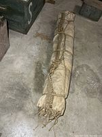 Full rolled hammock on concrete floor