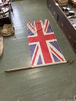 Flag laid out full length with pole attached