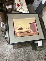 Both framed Kingston photos stacked, showing mat and frame
