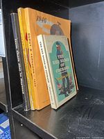 Four vintage war/history books on shelf