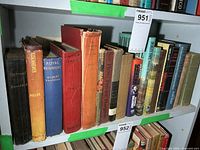 Shelf of war-related books showing spines and titles