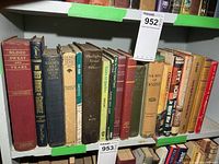 Full shelf showing majority of vintage war books