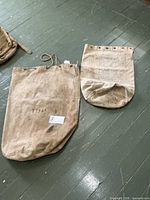 Both canvas military bags side by side full view