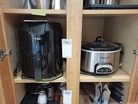 T-fal air fryer and Crock-Pot slow cooker side by side on shelf
