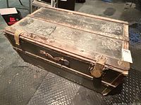 Top and side view of the antique trunk showing overall construction and wear