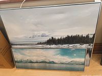 Both framed canvas prints leaning against wall showing relative sizes