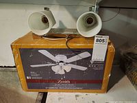 Zenith ceiling fan box with vanity fixture resting on top